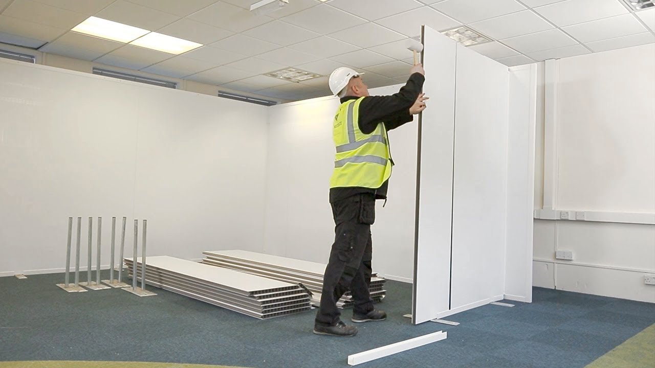 Professional team installing partition wall